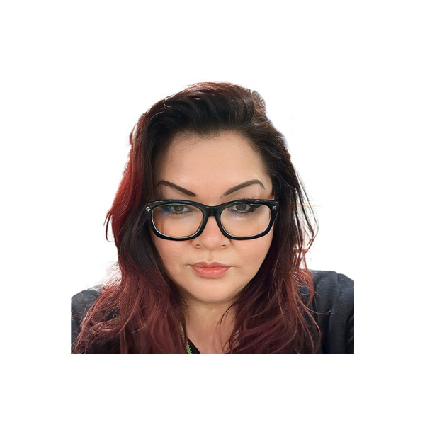 Woman with long, wavy, dark red hair wearing black-framed glasses and a black top, looking directly at the camera against a white background.
