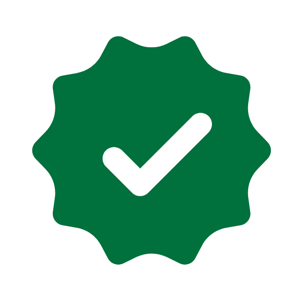 A green badge with a white checkmark in the center, symbolizing approval or verification, on a light gray background.